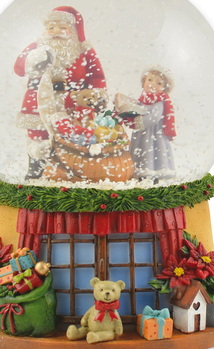 Spieluhr Schneekugel "Weihnachtsmann mit Geschenkesack und Teddy" 14 cm | 72284